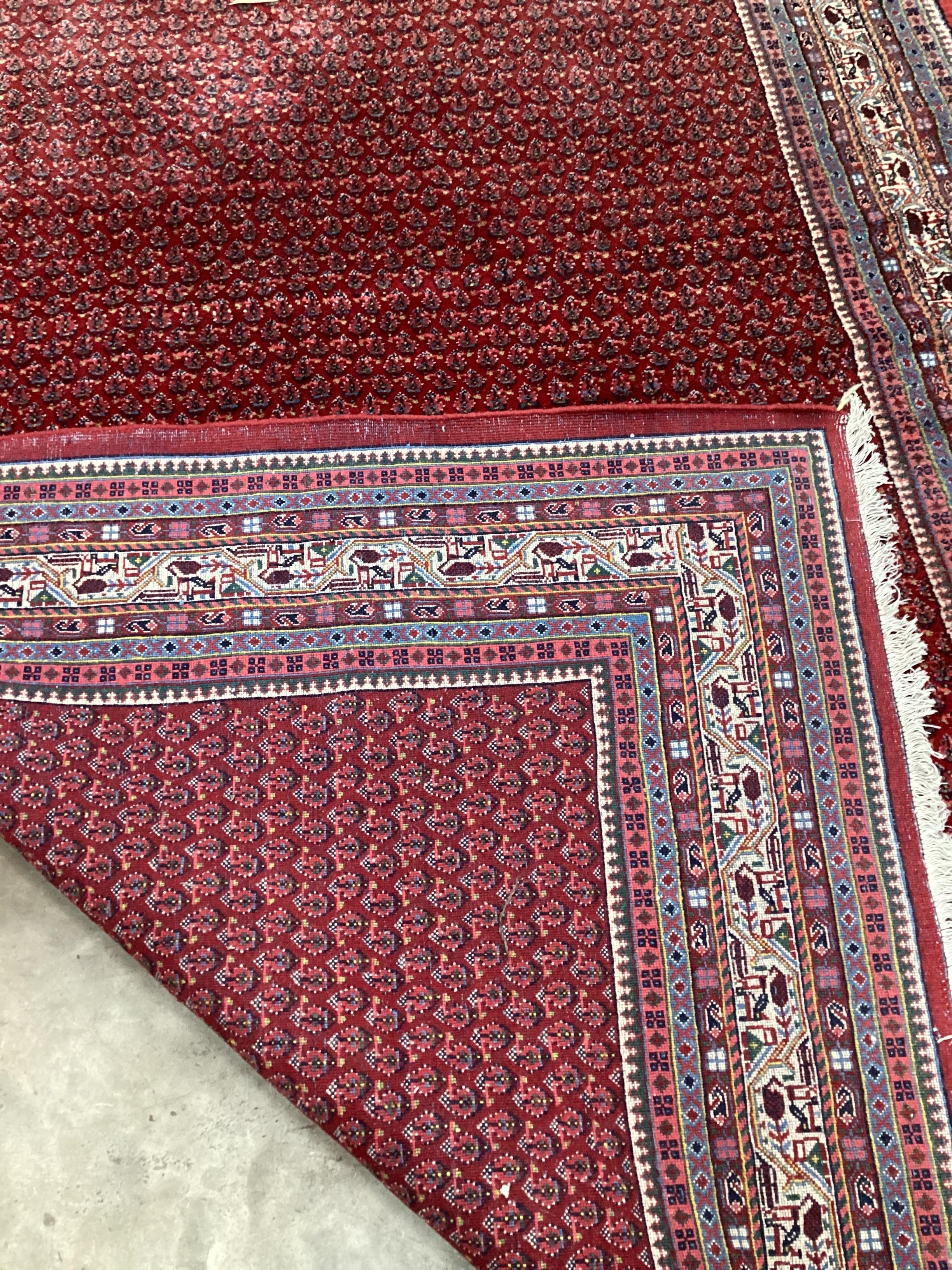 A Sarouk Mir red ground carpet, 288 x 191cm